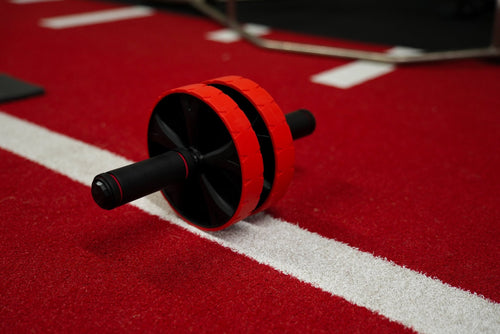 red and black ab roller for core workout